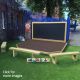 Engage imaginative play and promote creativity outdoors with exciting performances and classroom productions. This platform provides children with a space to perform plays, musicals, dance routines and drama performances in front of their peers and teachers. Take the classroom outside into the playground, where dancing, acting, singing, performing and storytelling will have a dedicated area thanks to the Deck Stage. This is a great way to introduce children to learning outdoors, allowing children and teachers alike to participate in outdoor teaching, reading and role-play activities. The Deck Stage is perfect for building confidence, encourage drama play, public speaking and teamwork. We manufacture Stages in various sizes to suit your requirements, but our most popular size is the 2.4m x 2.4m stage with 2no chamfered front corners. This works perfectly with our 2.4m x 1.2m Magnet Compatible Chalkboard and Timber Bench Seating, as seen in the images.