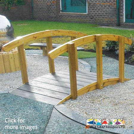 Cross streams, paths, or imaginary worlds using the Timber Arched Bridge. It can also feature within a Roadway/Track, providing additional play value to an already enticing route through the playground! The Benefits of a Timber Arched Bridge Develop motor skills and balance while roaming across the Timber Arched Bridge. This item can bring a once-dull area to life, as children will venture into new worlds whilst crossing the bridge from one space, into another! The Timber Arched Bridge is also quaint in appearance, a complimentary focal point for any playground or Natural Play area. The Timber Arched Bridge is equipped with a Safadeck footbridge, providing you with peace of mind due to the anti-slip properties. This surfacing is far more durable than typical decking and the unit is built to last with robust timber, allowing children to enjoy the equipment for years to come.