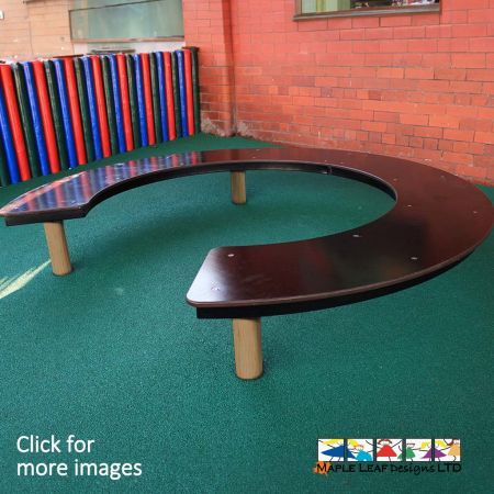 Curved Bench, Horseshoe design. Suitable for children of all ages. Ideal seating for playgrounds, yards, public areas. A great way to encourage socialisation and team building skills. Communication Skills.